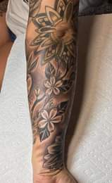 May be an image of one or more people, tattoo and flower